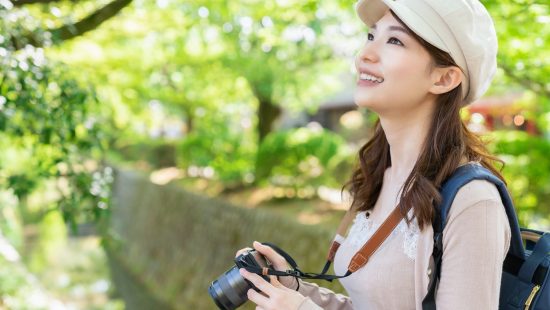 Adobe Stock #294785524 Asian female sightseeing taking photos, Kyoto, Japan